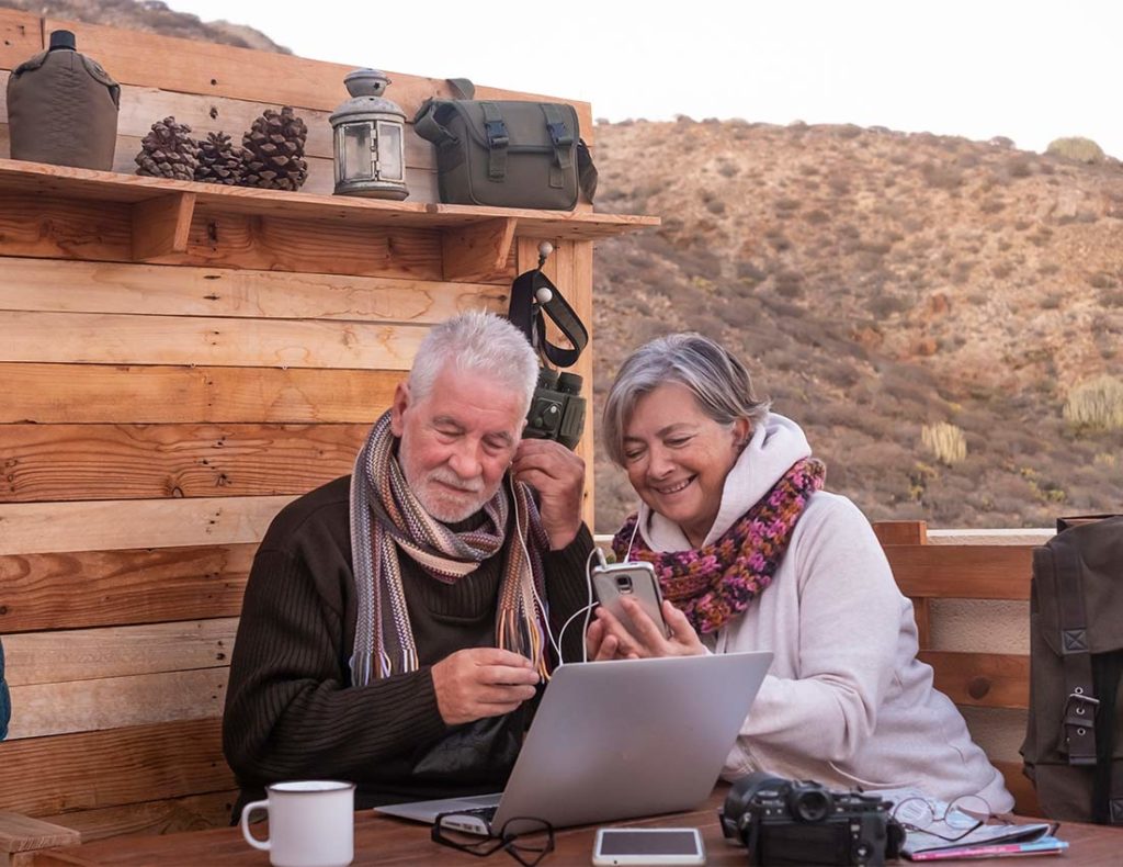senior couple at an outdoor rustic restaurant guaranteed income loveland co