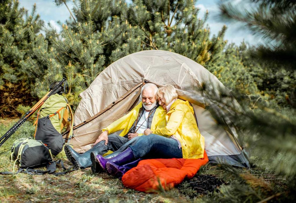 senior couple camping guaranteed lifetime income loveland co